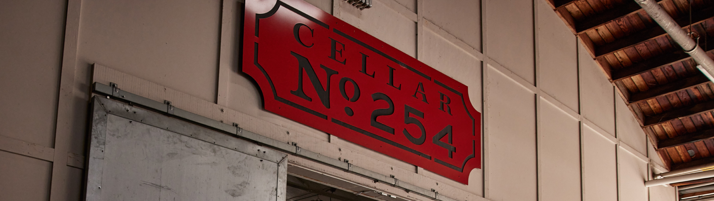 A red 'Cellar No.254' sign above a door.
